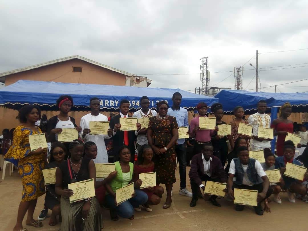 A group of young participants holding certificates during a PICHNET ceremony.